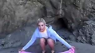 Blonde amateur indulges in self-pleasure on the beach